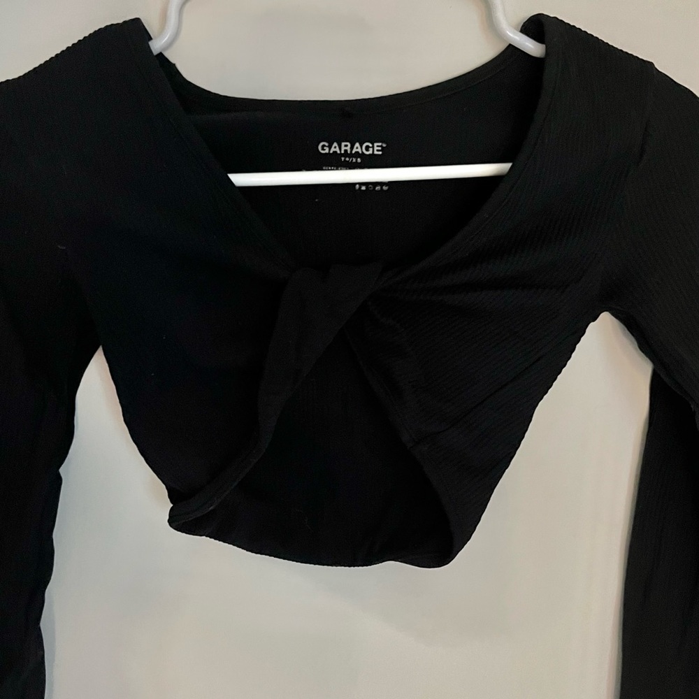 super cute long sleeve with a twist in the middle. very flattering